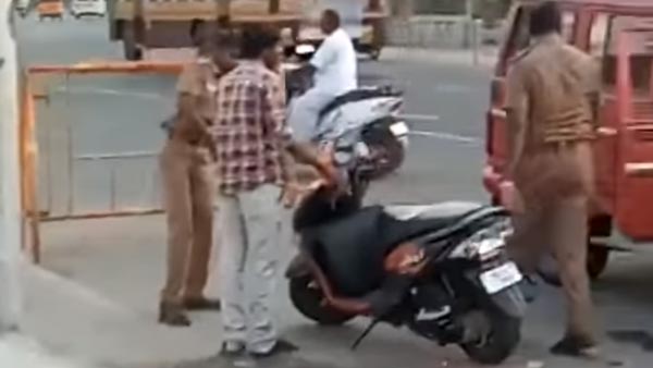 റോഡരികില് നിര്ത്തിയിട്ട സ്കൂട്ടര് തല്ലി തകര്ത്ത് പൊലീസ് — വീഡിയോ
